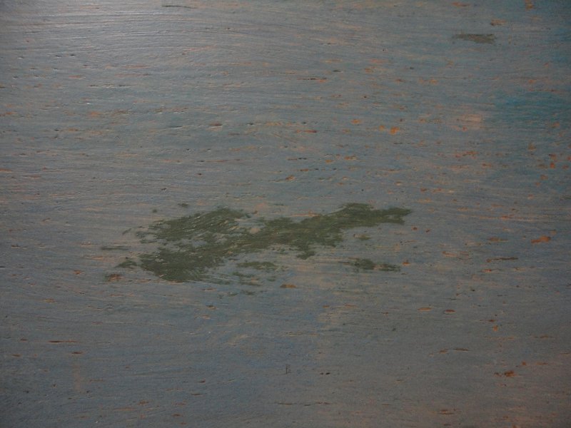 Click the image for a view of: Detail of over-paint during the cleaning process