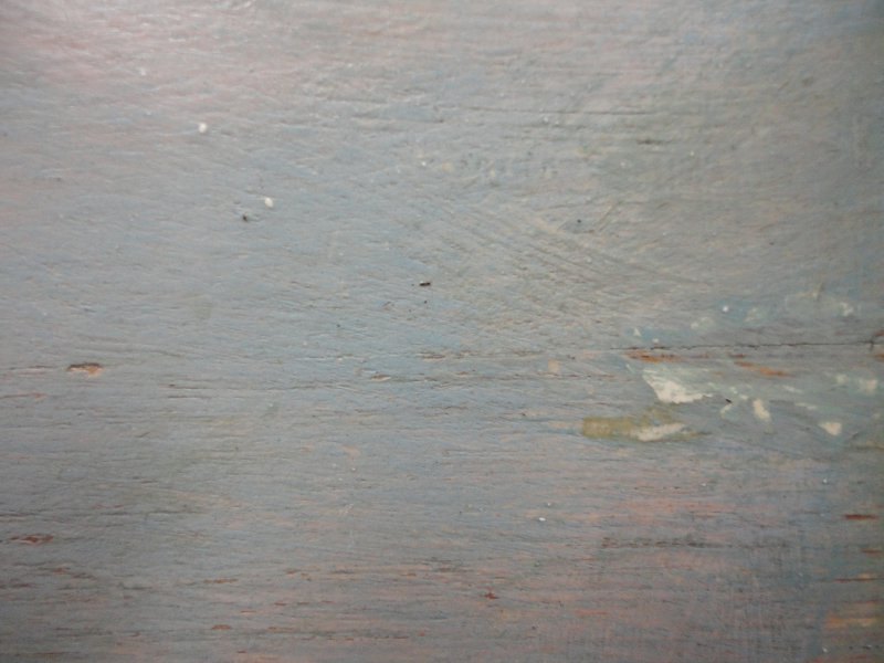 Click the image for a view of: Detail of over-paint during the cleaning process